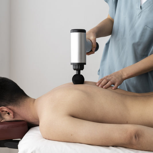 how to use massage gun on back