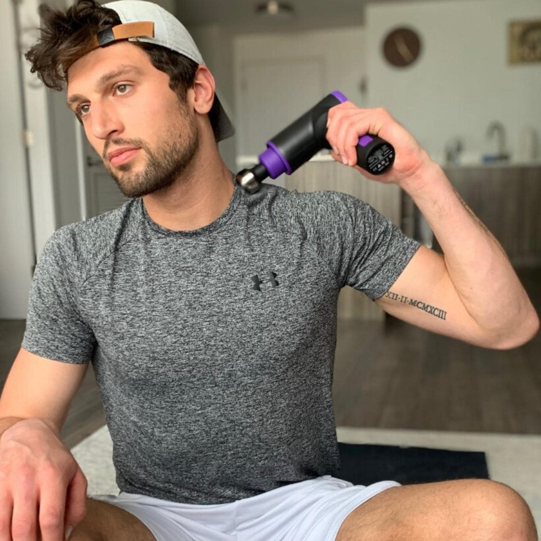 Massage gun use in the comfort of home